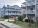 Complex exterior shows multiple buildings with patios and assigned parking at 3518 Shepherds Path, Decatur, GA 30034
