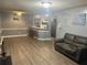 Open floor plan of the living room, with grey walls, hardwood floors and kitchen at 3518 Shepherds Path, Decatur, GA 30034