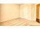Neutral-colored bedroom featuring carpeting, light walls, and a closed door at 711 Park Place Way, Social Circle, GA 30025