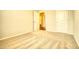 Bright bedroom featuring neutral carpet, light-colored walls, and a door to an ensuite bathroom at 711 Park Place Way, Social Circle, GA 30025