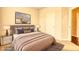 Serene bedroom with a comfortable bed, decor, and a light, neutral color palette for a relaxing atmosphere at 711 Park Place Way, Social Circle, GA 30025