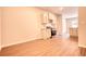Spacious kitchen featuring stainless steel appliances and access to adjacent living area at 711 Park Place Way, Social Circle, GA 30025