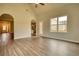 Inviting living room featuring laminate flooring, abundant natural light, and easy access to the kitchen at 711 Park Place Way, Social Circle, GA 30025