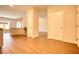 Open-concept area featuring kitchen, living room and a hallway for easy living at 711 Park Place Way, Social Circle, GA 30025