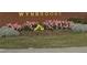 Wynbrooke community sign with colorful flower beds in front of it at 787 Wynbrooke Pkwy, Stone Mountain, GA 30087