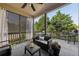 Inviting covered deck with comfortable seating and outdoor views at 8385 E Village School E Dr, Cumming, GA 30041