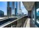 Concrete balcony offering city views with rod iron railings and glass walls at 1080 Peachtree Ne St # 1504, Atlanta, GA 30309