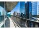 Balcony with stunning city views and a modern glass-walled building backdrop at 1080 Peachtree Ne St # 1504, Atlanta, GA 30309