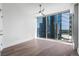 Bedroom with a ceiling fan, hardwood floors, and amazing city views at 1080 Peachtree Ne St # 1504, Atlanta, GA 30309