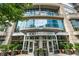 Building Entrance showing the entrance to 1010 Midtown with lush landscaping at 1080 Peachtree Ne St # 1504, Atlanta, GA 30309