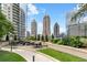 Outdoor seating area with lush landscaping and city views at 1080 Peachtree Ne St # 1504, Atlanta, GA 30309