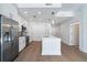 Bright kitchen with stainless steel appliances, white cabinets, and a large island with a sleek countertop at 1080 Peachtree Ne St # 1504, Atlanta, GA 30309