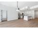 Spacious open floor plan with kitchen, stainless appliances, hardwood floors, and modern pendant lighting at 1080 Peachtree Ne St # 1504, Atlanta, GA 30309