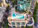 Aerial view of rooftop pool deck with lounge chairs and city views at 1080 Peachtree Ne St # 1504, Atlanta, GA 30309