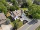 Aerial shot showcases the lovely home, mature trees, and meticulously landscaped yard in a peaceful setting at 1127 Bank Se St, Smyrna, GA 30080