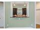 Custom bar area with a view to the living room, dark wood, and granite countertop at 1127 Bank Se St, Smyrna, GA 30080