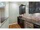 Close up of a home bar featuring granite countertop, custom cabinets and wine storage at 1127 Bank Se St, Smyrna, GA 30080