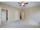 Large bedroom with neutral walls, ensuite bath and ceiling fan at 1127 Bank Se St, Smyrna, GA 30080