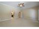 Spacious bedroom with neutral carpet and trim; door leads to en-suite bathroom at 1127 Bank Se St, Smyrna, GA 30080