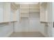Walk-in closet with open shelving for organized storage at 1127 Bank Se St, Smyrna, GA 30080
