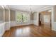 Elegant dining room with hardwood floors, shuttered windows, and decorative chandelier lighting at 1127 Bank Se St, Smyrna, GA 30080