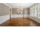Formal dining room boasts hardwood floors, wainscoting, and bright natural light at 1127 Bank Se St, Smyrna, GA 30080