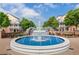 Scenic view of a tiered fountain with beautiful landscaping, benches, and nearby buildings at 1127 Bank Se St, Smyrna, GA 30080