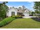 Beautiful home with charming curb appeal, featuring lush landscaping and a convenient two-car garage at 1127 Bank Se St, Smyrna, GA 30080
