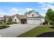 Attractive home with a well-manicured lawn, colorful flowerbeds, and a spacious driveway leading to the two-car garage at 1127 Bank Se St, Smyrna, GA 30080