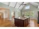 Bright kitchen with a large island, stainless steel appliances, and a seamless open floor plan at 1127 Bank Se St, Smyrna, GA 30080