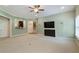 Large living room with custom bar area, stairs, and neutral color carpet at 1127 Bank Se St, Smyrna, GA 30080