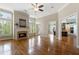 Bright and spacious living room with hardwood floors, fireplace, and a seamless flow to the kitchen at 1127 Bank Se St, Smyrna, GA 30080