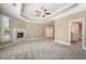 Large main bedroom featuring a fireplace, neutral carpet, and access to both the main bathroom and walk-in closet at 1127 Bank Se St, Smyrna, GA 30080