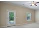 Bright, carpeted room with natural light streaming through the door and window at 1127 Bank Se St, Smyrna, GA 30080