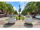 Charming street view in a neighborhood lined with trees and flower-filled planters at 1127 Bank Se St, Smyrna, GA 30080