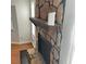 Close-up of the stone fireplace with a wooden mantle and a black firebox at 4149 Silver Hill Ct, Snellville, GA 30039