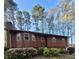 Charming split-level home with lovely landscaping and flowering shrubs in front yard at 4149 Silver Hill Ct, Snellville, GA 30039