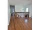 Bright hallway with hardwood floors and access to several rooms in the home at 4149 Silver Hill Ct, Snellville, GA 30039