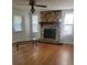 Inviting living room with stone fireplace, hardwood floors and lots of natural light at 4149 Silver Hill Ct, Snellville, GA 30039