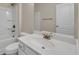 Bright bathroom features a white vanity with brushed gold hardware and a shower-tub combination at 5140 Woodline View Cir, Auburn, GA 30011