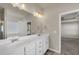 Bathroom featuring double vanity, tile flooring, and modern lighting fixtures at 5140 Woodline View Cir, Auburn, GA 30011