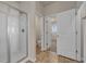 Bathroom featuring glass shower, tile flooring and a doorway to the water closet at 5140 Woodline View Cir, Auburn, GA 30011