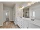 Bathroom with double sink vanity, tile floor, and separate water closet at 5140 Woodline View Cir, Auburn, GA 30011