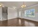 Dining room featuring hardwood floors, stairs to the upper level, and a glass door at 5140 Woodline View Cir, Auburn, GA 30011