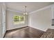 Bright dining room with hardwood floors and a view to the backyard at 5140 Woodline View Cir, Auburn, GA 30011