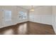 View of dining room featuring hardwood floors, chandelier, and door to the backyard at 5140 Woodline View Cir, Auburn, GA 30011