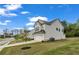 Two-story home with vinyl siding, attached two car garage and well maintained lawn at 5140 Woodline View Cir, Auburn, GA 30011