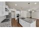 Spacious kitchen featuring granite countertops, stainless steel appliances, and an island at 5140 Woodline View Cir, Auburn, GA 30011