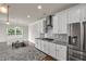 Stylish kitchen with stainless steel appliances, granite countertops, and ample cabinet space at 5140 Woodline View Cir, Auburn, GA 30011