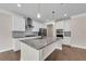 Well-equipped kitchen with granite countertops, stainless steel appliances, and white cabinets at 5140 Woodline View Cir, Auburn, GA 30011